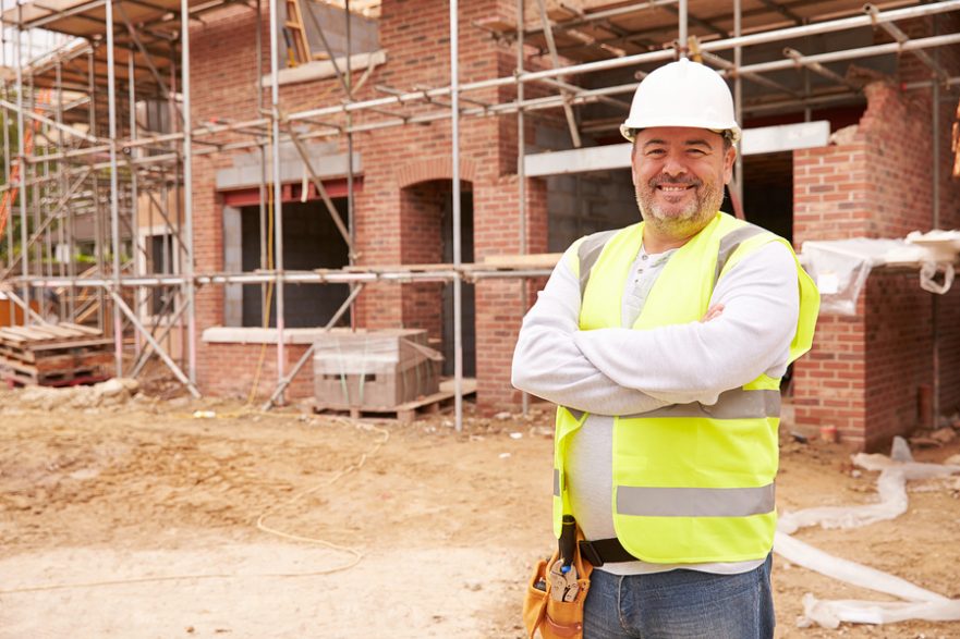 Portrait of a housebuilder on a construction site